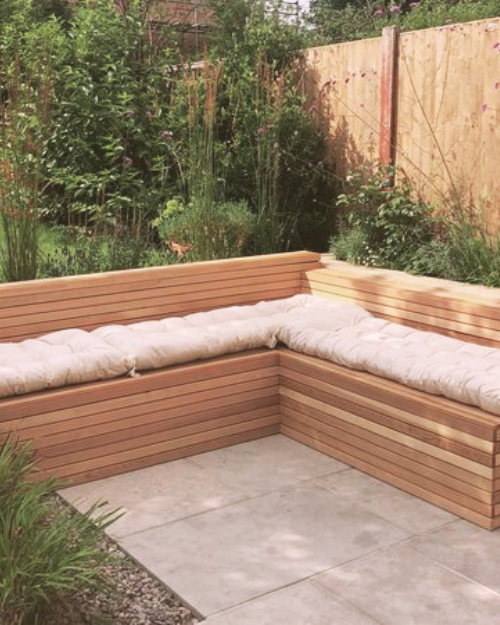 wooden corner garden seating area
