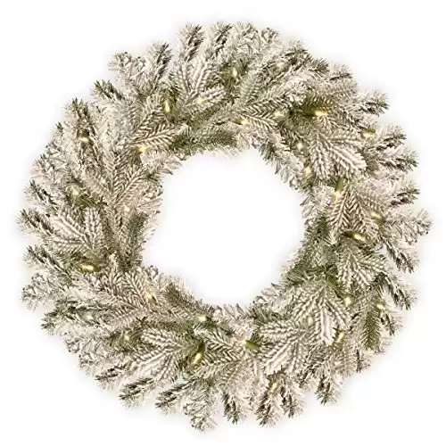National Tree Company Pre-Lit 'Feel Real' Artificial Christmas Wreath, Green, Snowy Sheffield Spruce, White Lights, Decorated with Frosted Branches, Christmas Collection, 5"D x 24"...